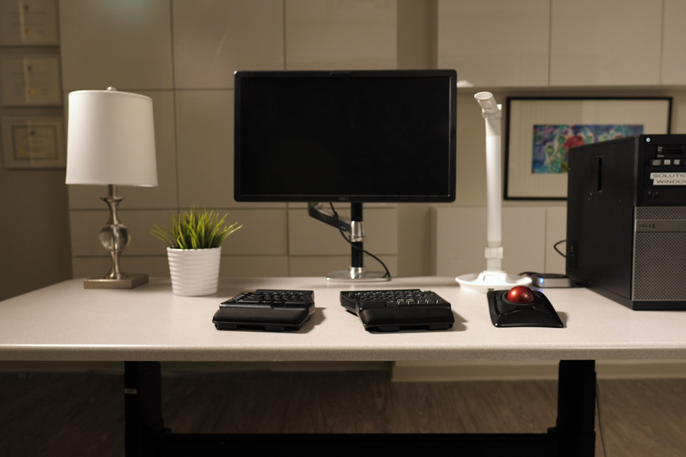 Desk with computer and assistive technology equipment