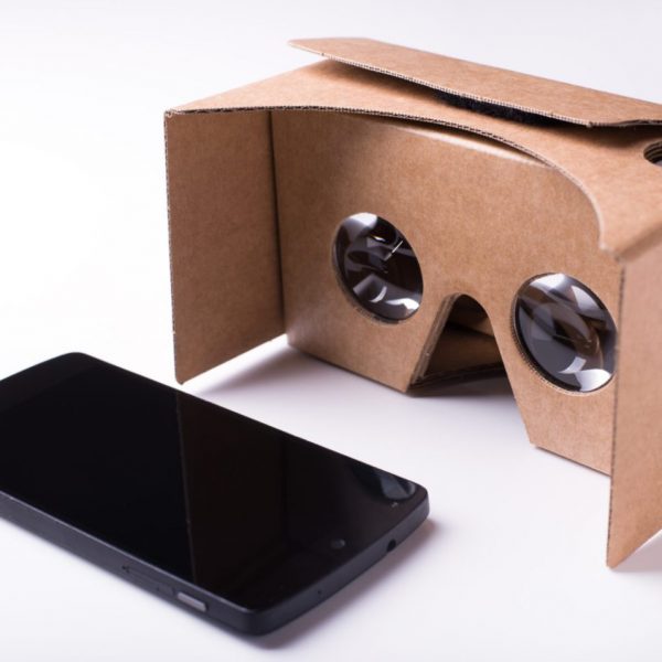 A woman using Google Cardboard