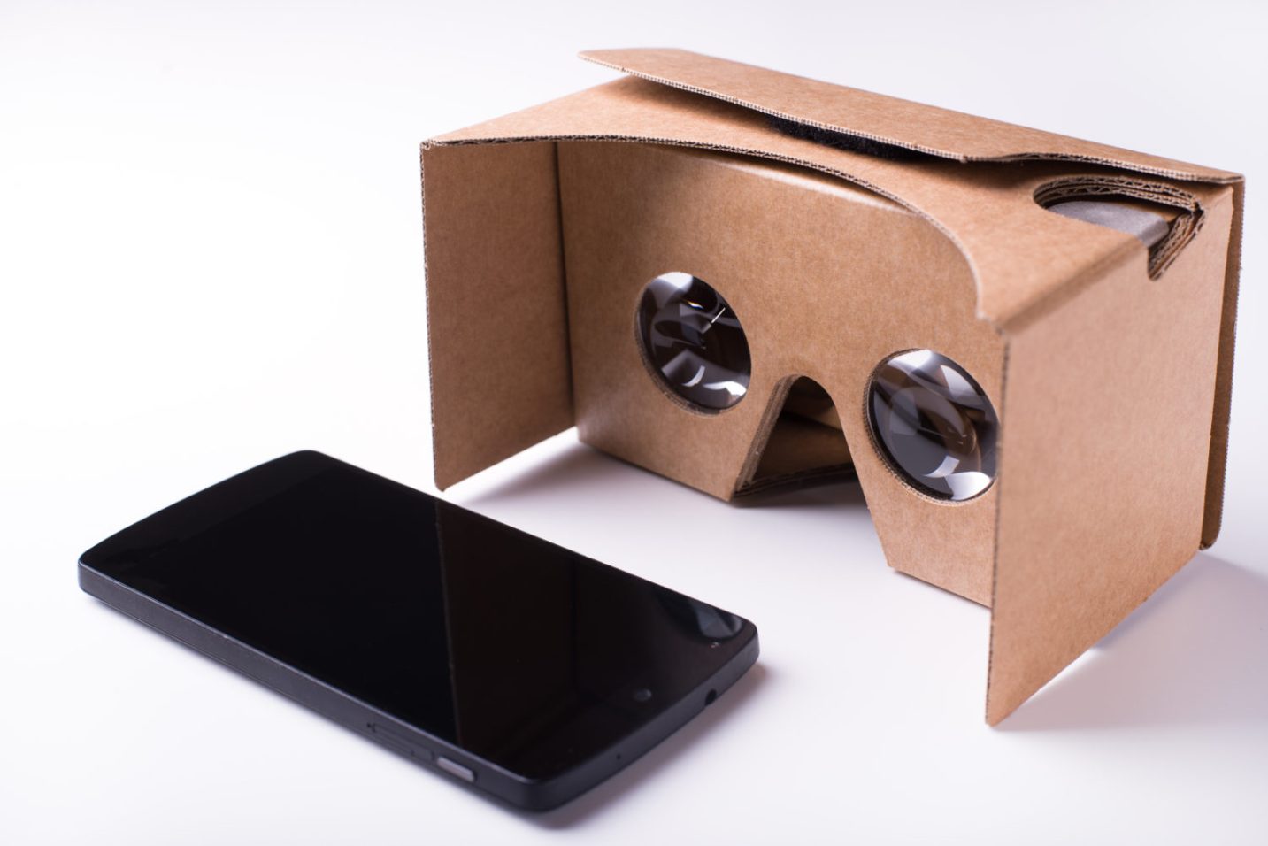 A woman using Google Cardboard