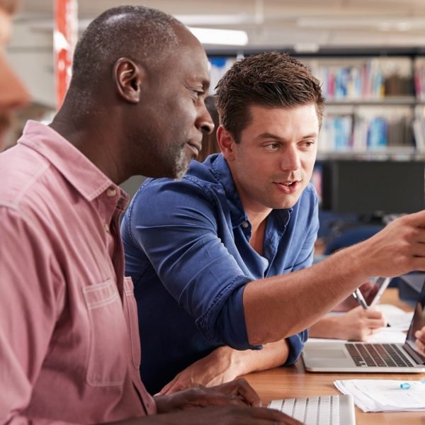 Men looking at a computer together