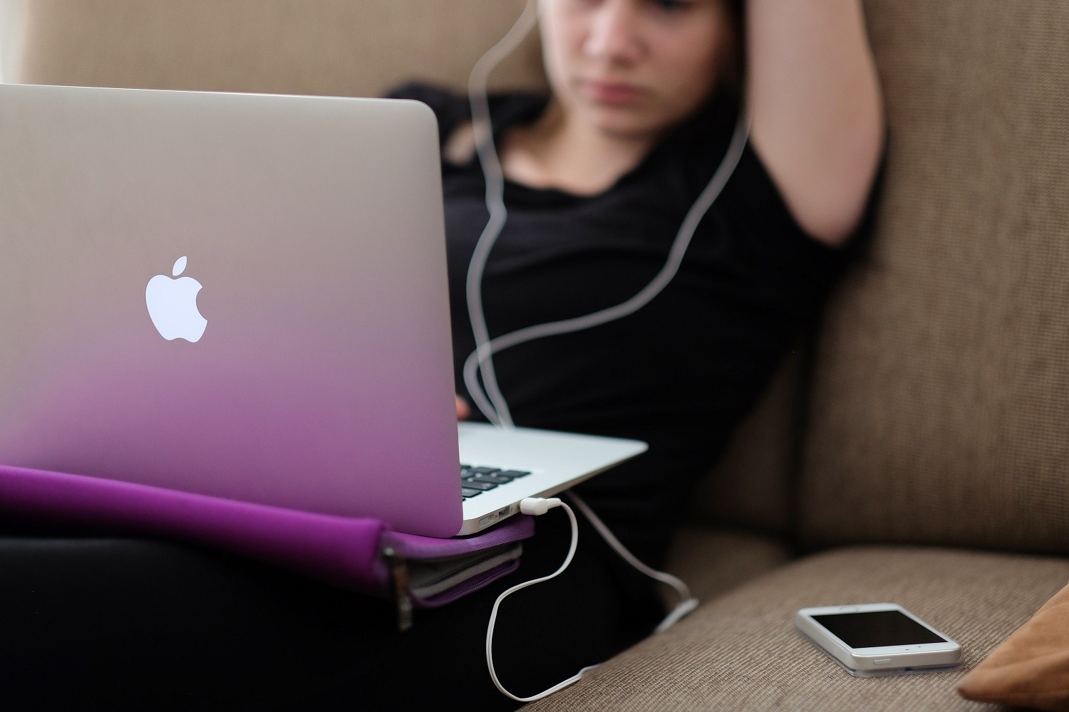 student using laptop at home