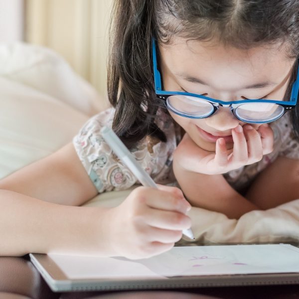 a child working on a tablet