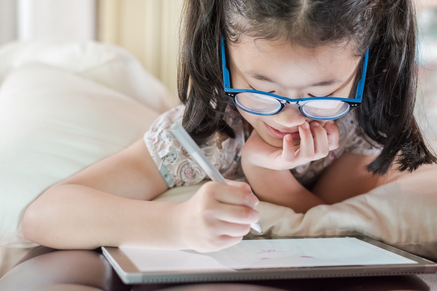 a child working on a tablet