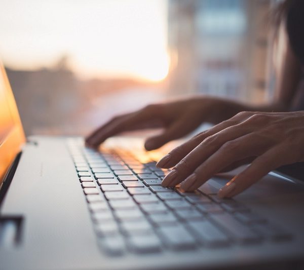 hands on a laptop keyboard