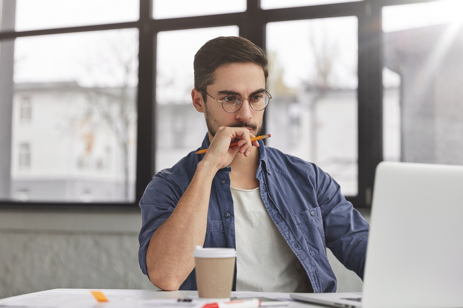 man concentrating on his computer