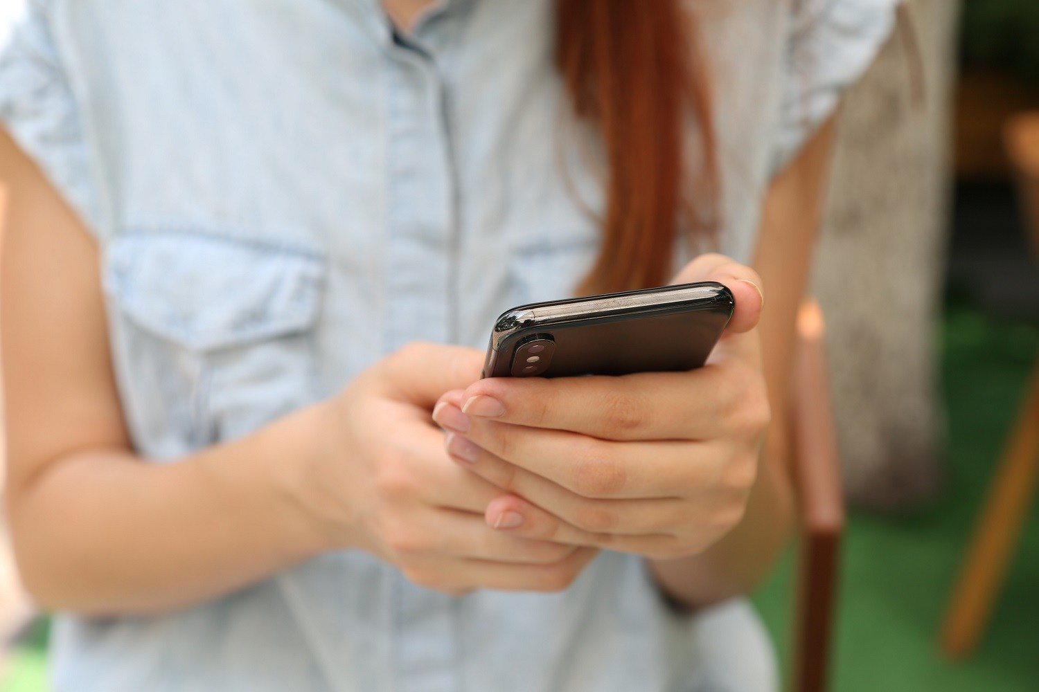 Close-up of person's hands using a smartphone