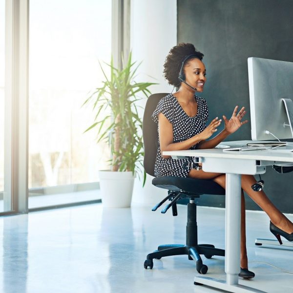 Shot of a support agent working in a modern office