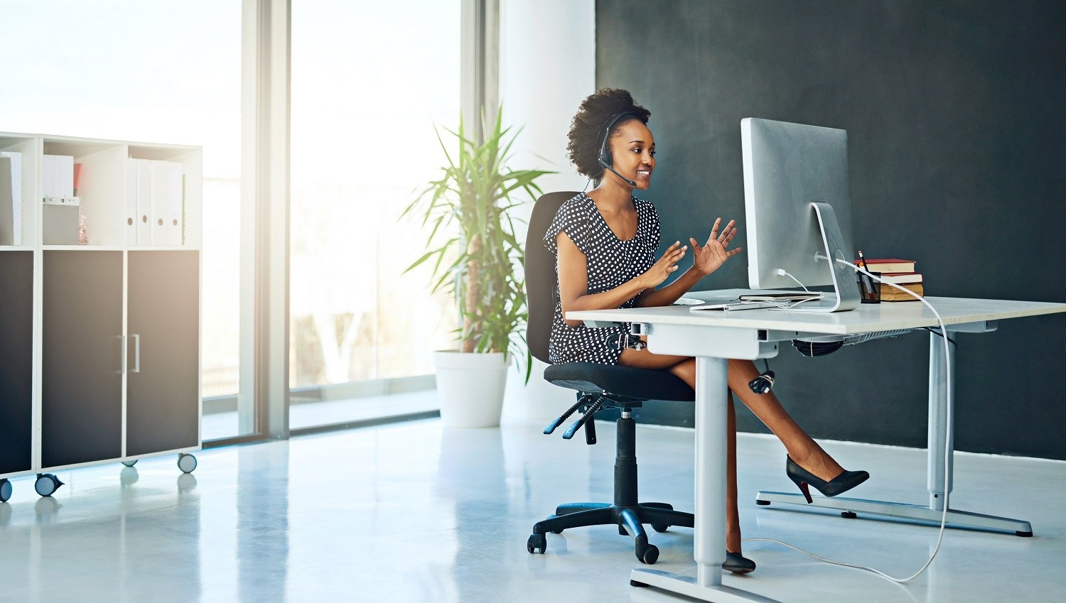 Shot of a support agent working in a modern office