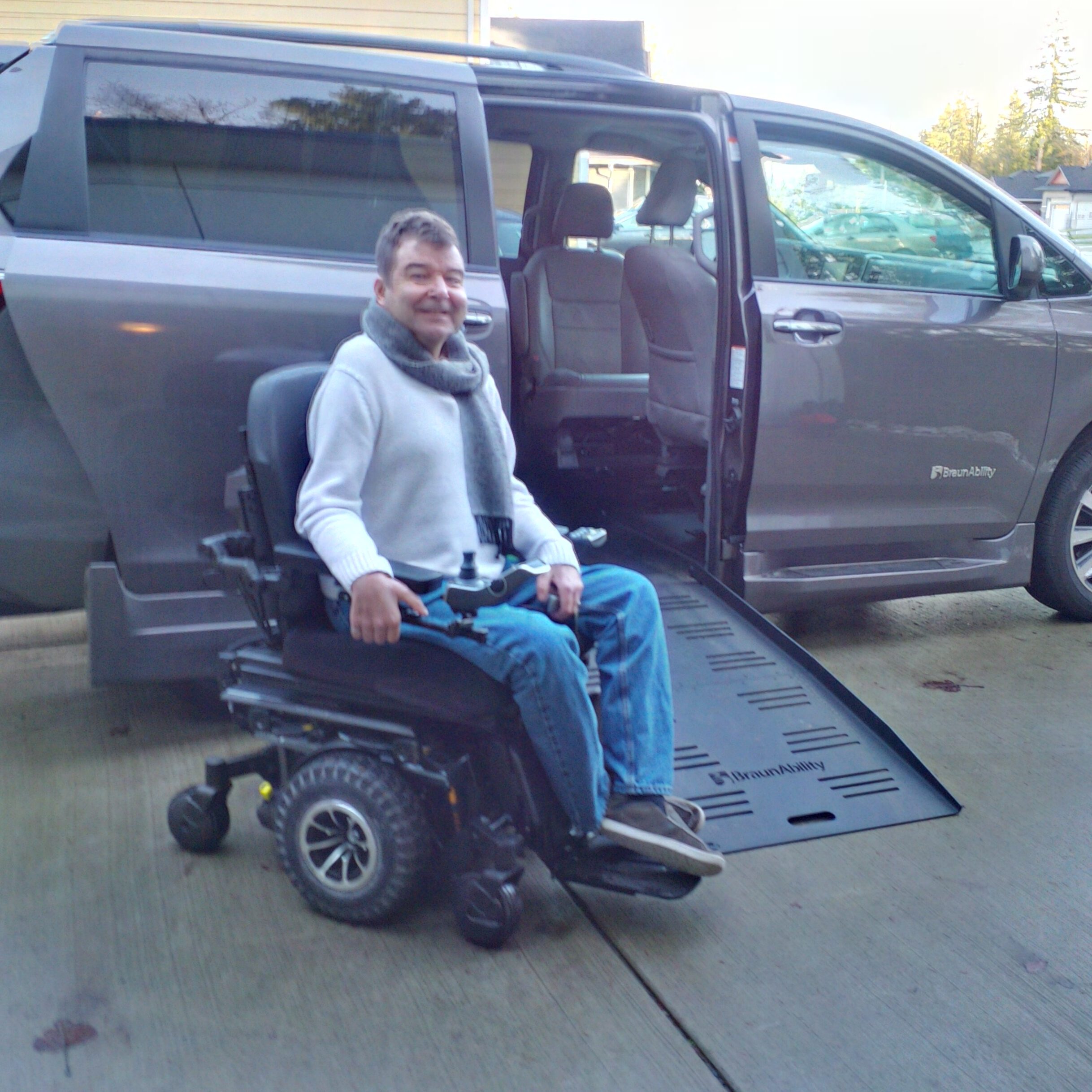 Robert next to his wheelchair accessible van
