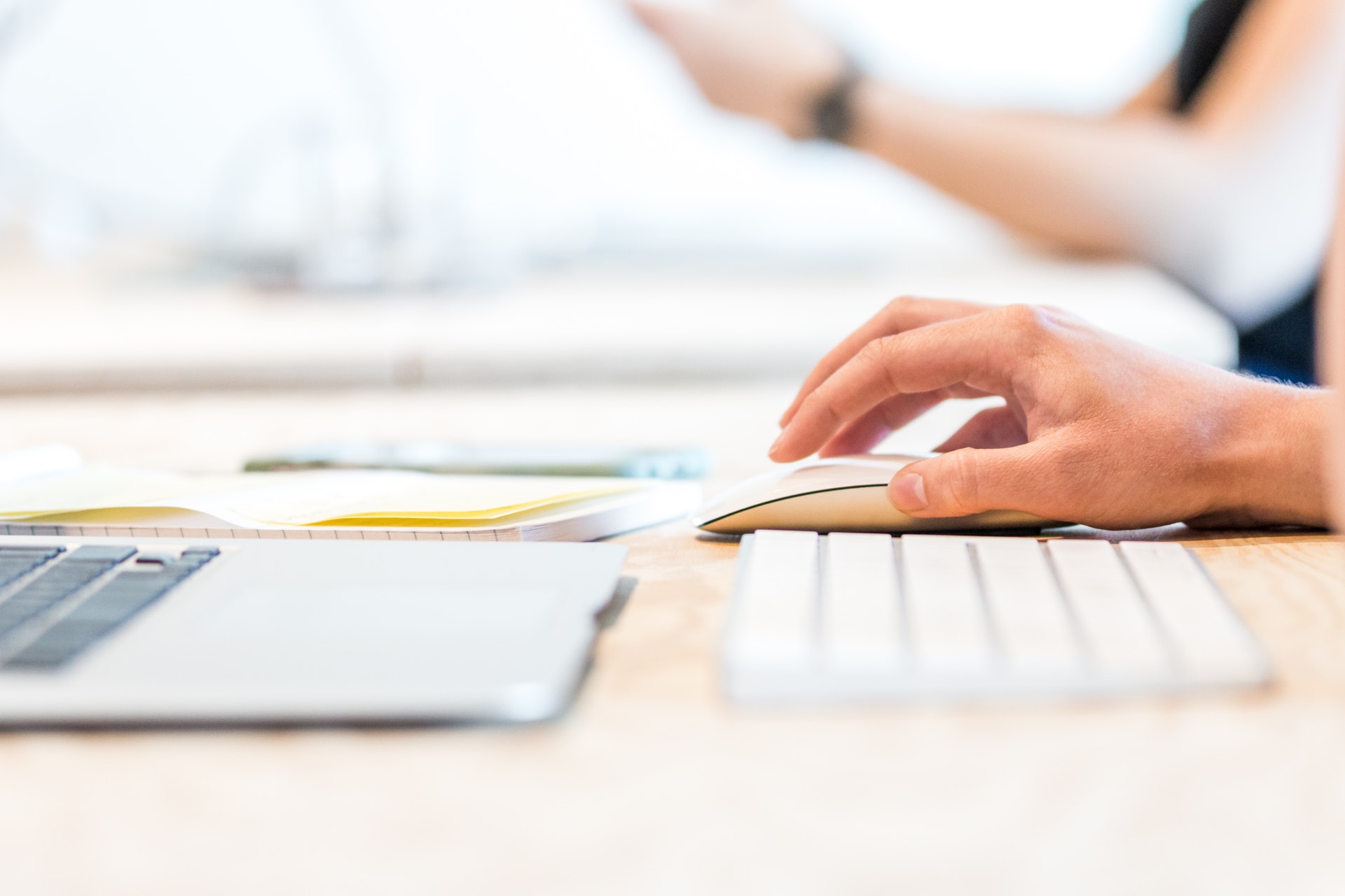 close-up of person's hand using a computer mouse