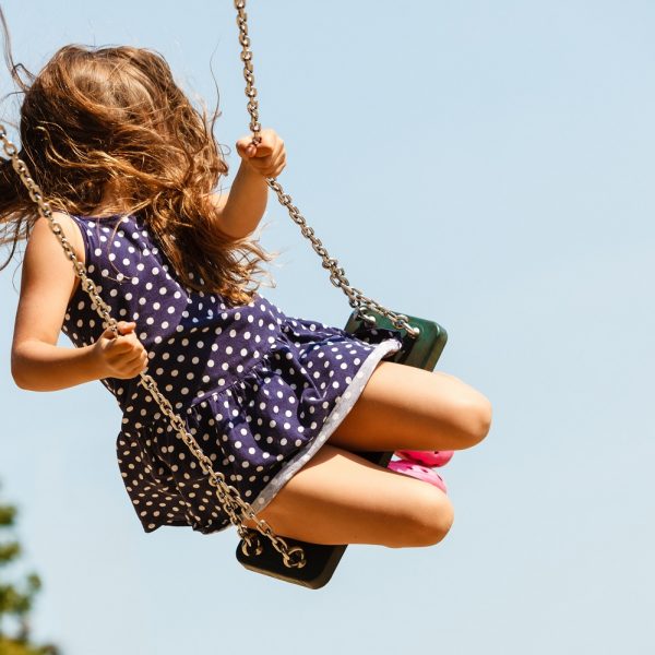 a young girl on a swing