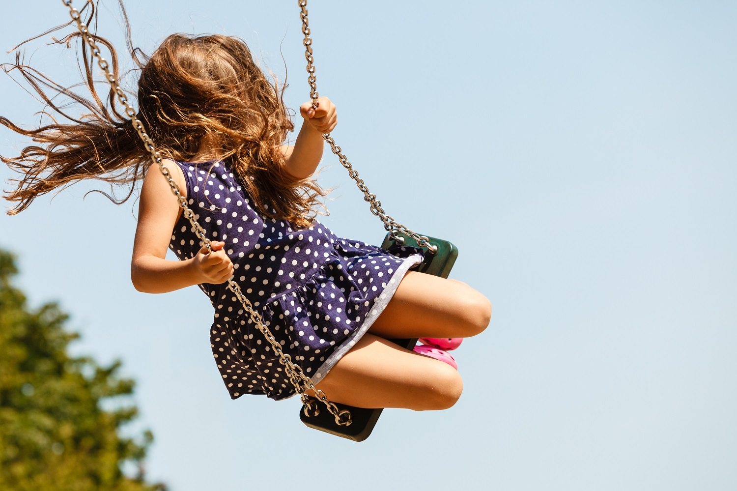 a young girl on a swing