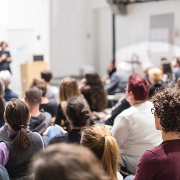 a student sitting in an in-person lecture