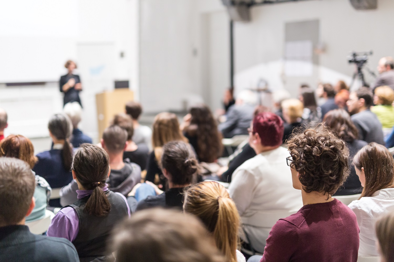 a student sitting in an in-person lecture