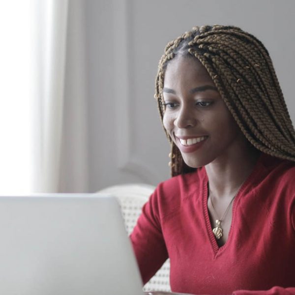 a woman browses her laptop