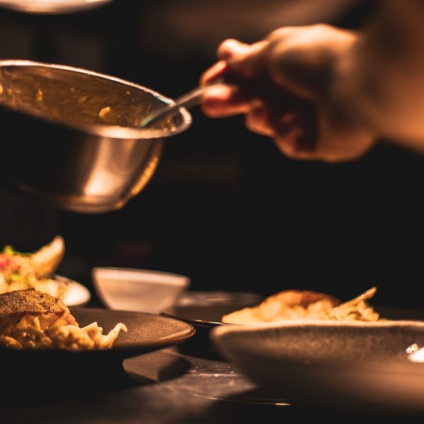 A person cooking food in a pan