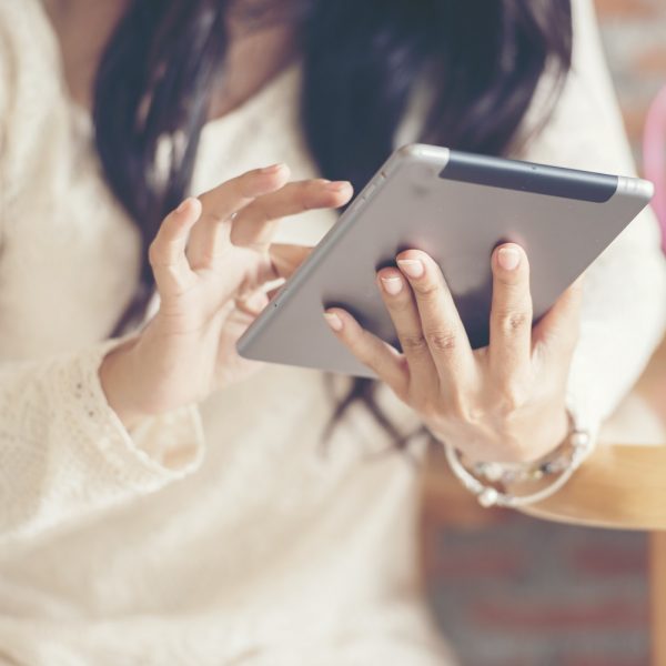 a woman uses a tablet