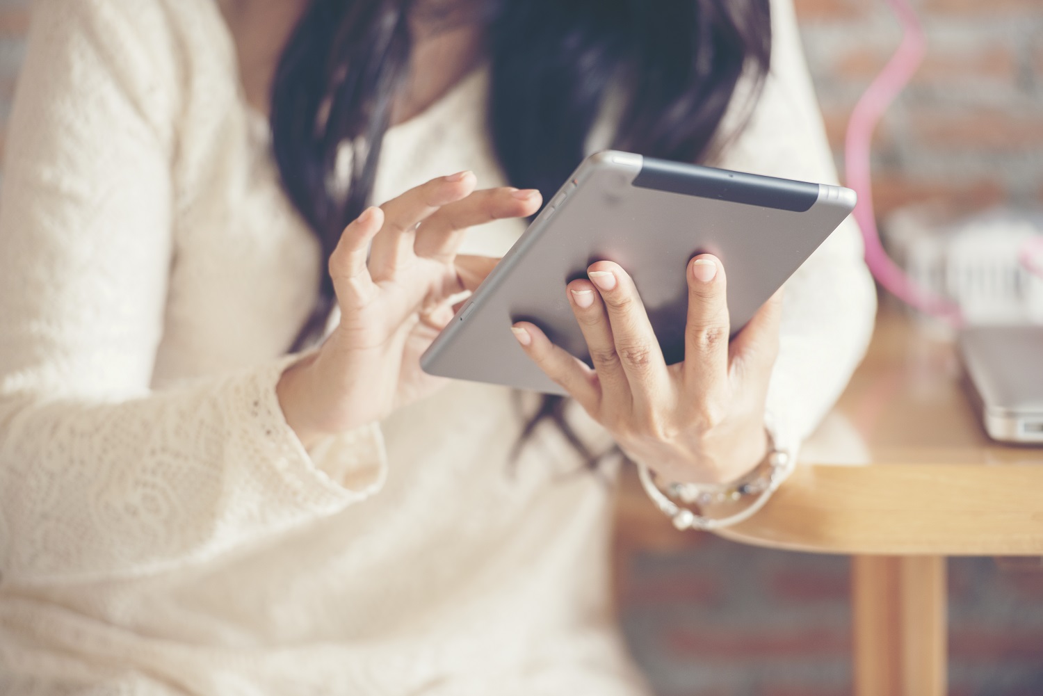 a woman uses a tablet