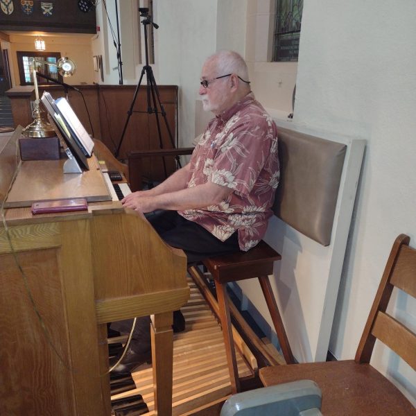 WorkBC Assistive Technology Services participant Freeman playing the organ at his church