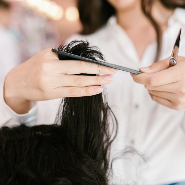 a hairstylist cutting a client's hair