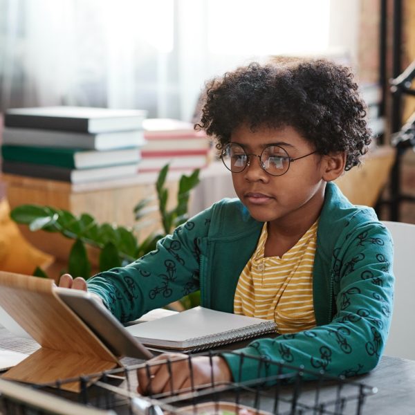 a child using a tablet to study