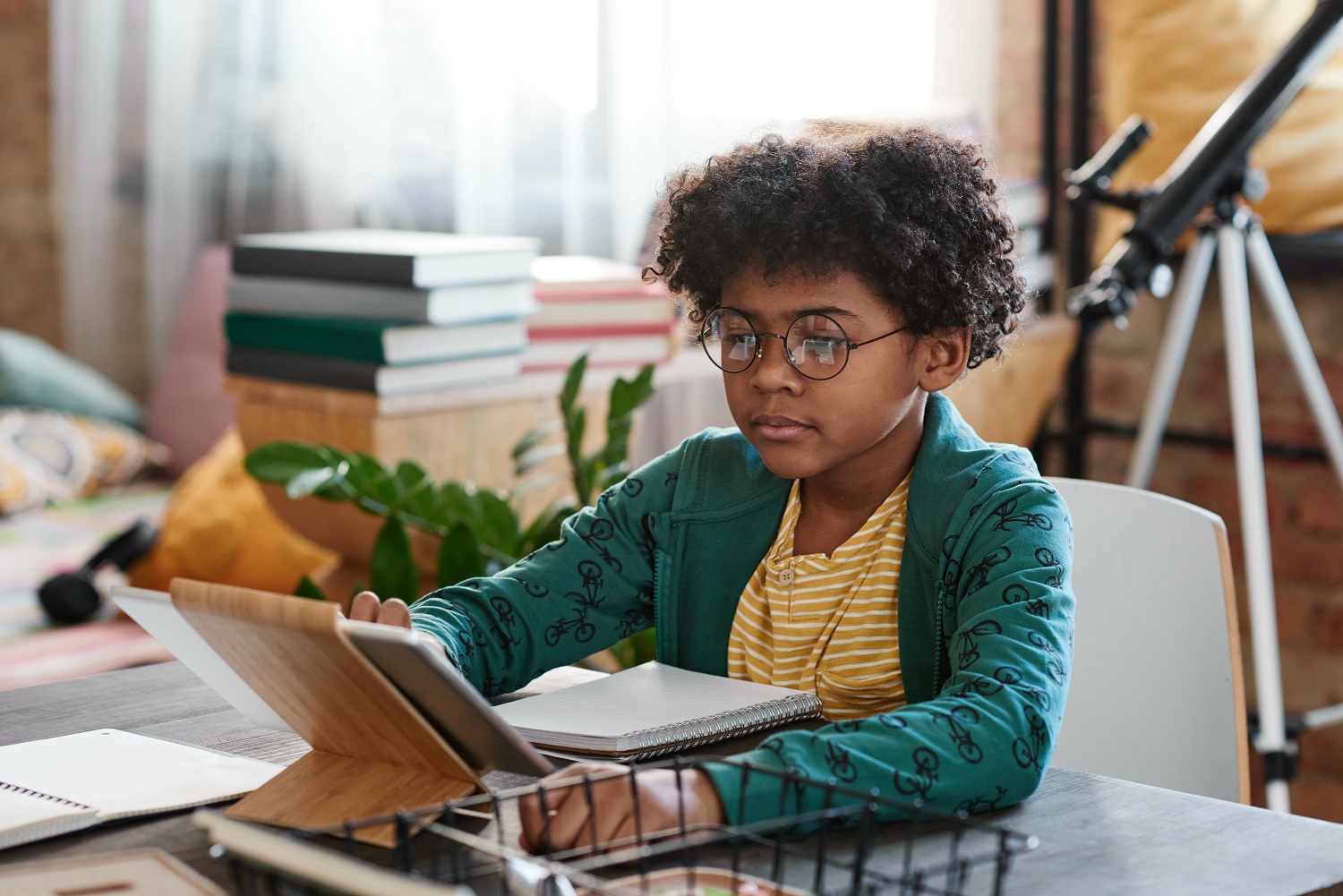 a child using a tablet to study