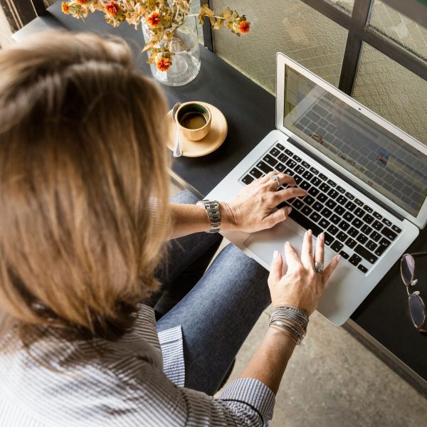 A woman using a laptop.