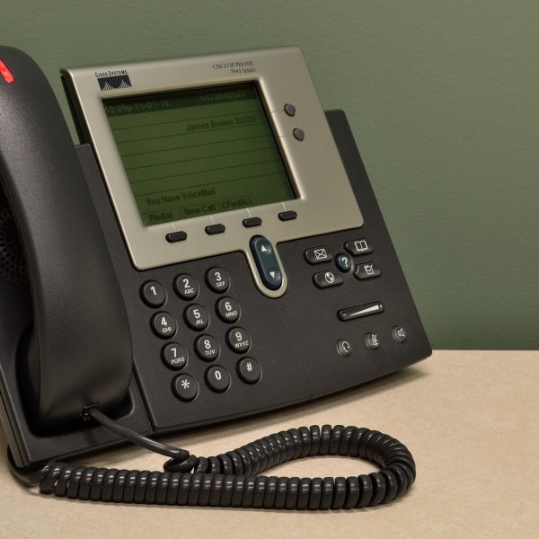 A landline phone in an office.