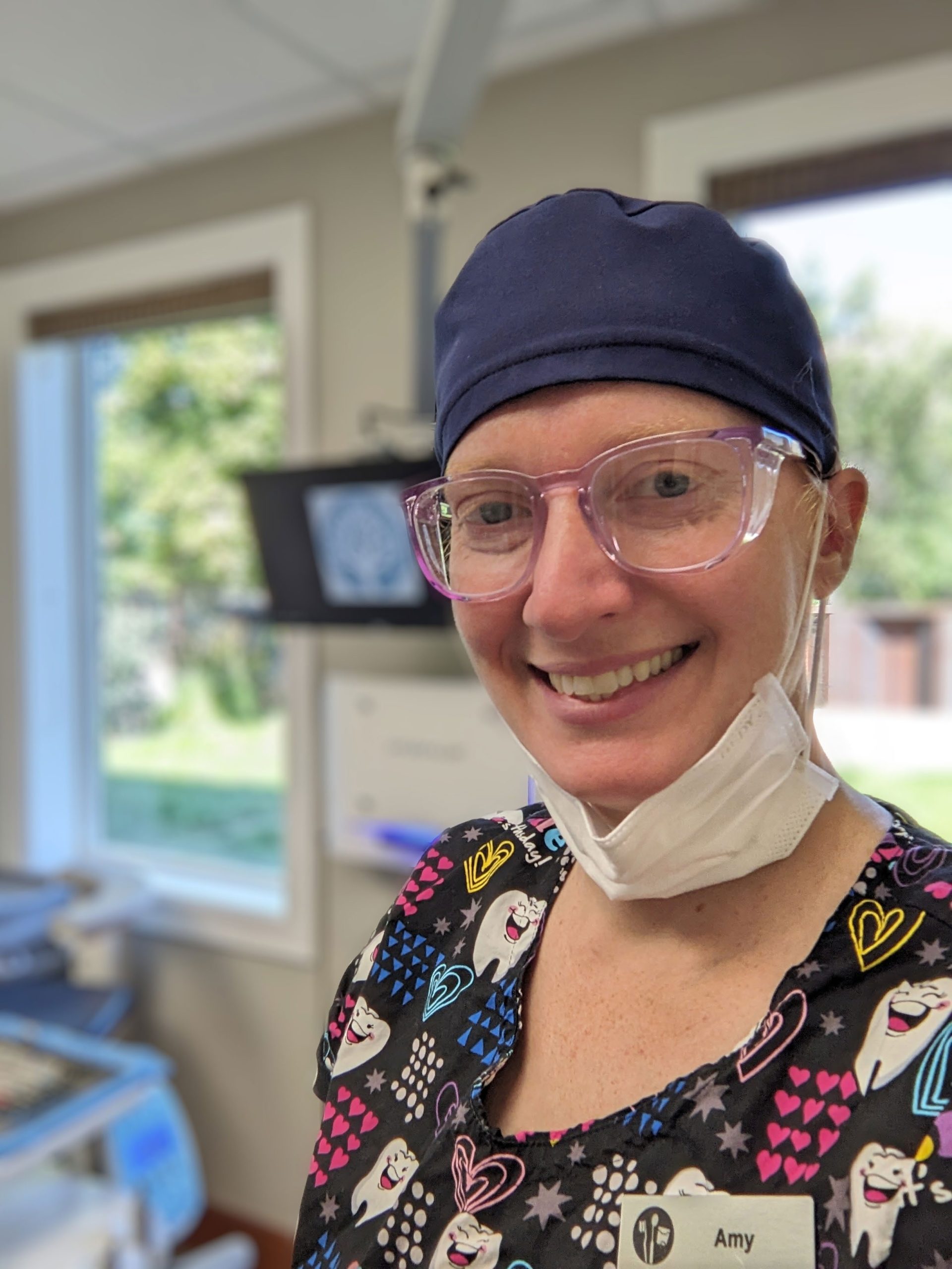 WorkBC Assistive Technology Services participant Amy, wearing a surgical mask and cap.