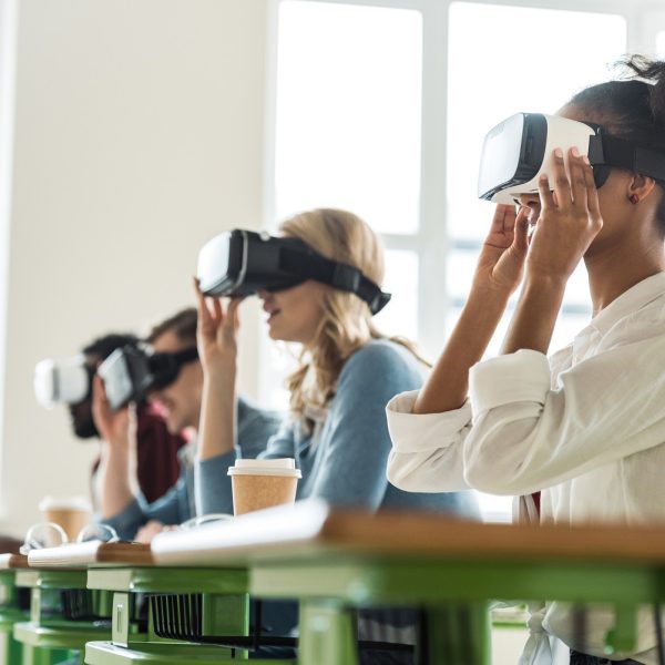 A row of people wearing VR headsets.