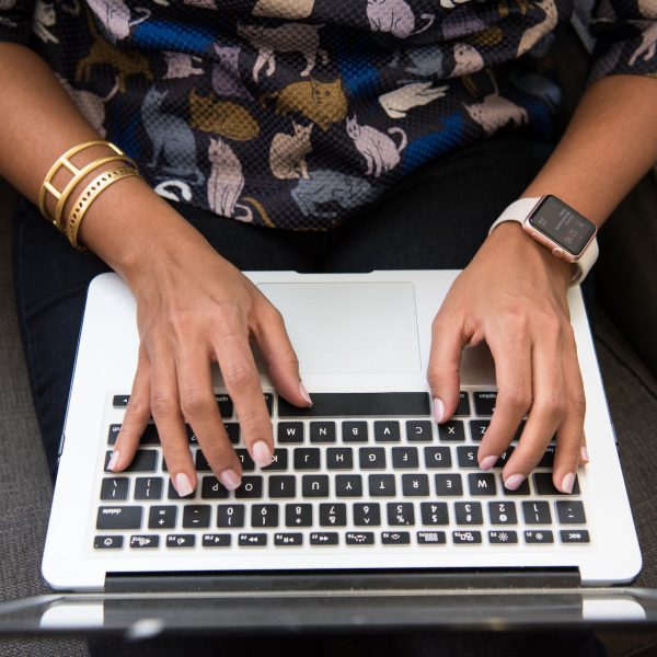 A person types on a computer.