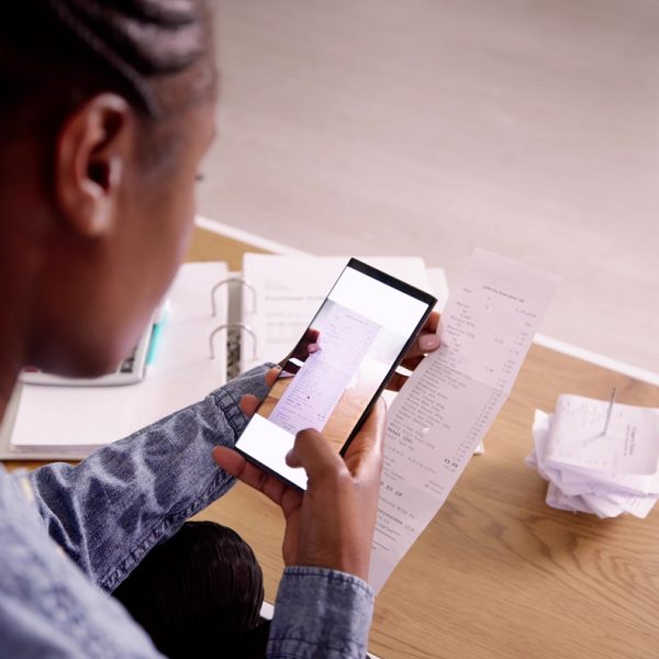 A person scans a receipt with their phone.