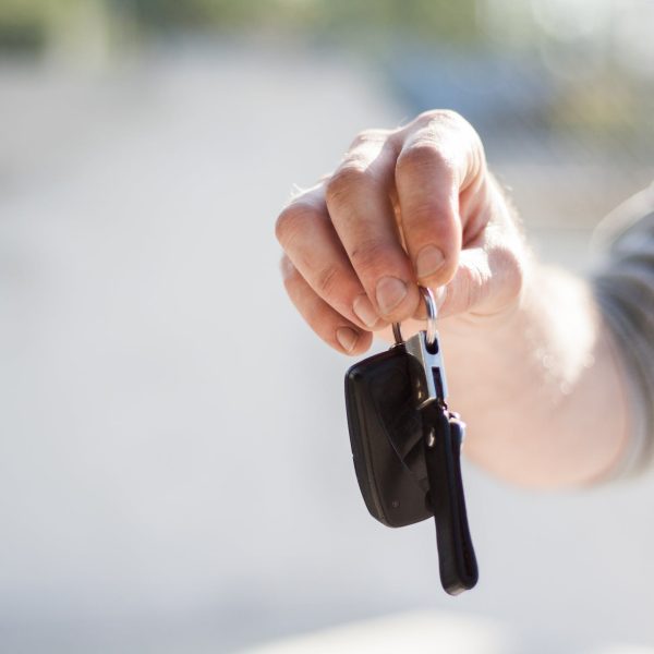 A person holding car keys.