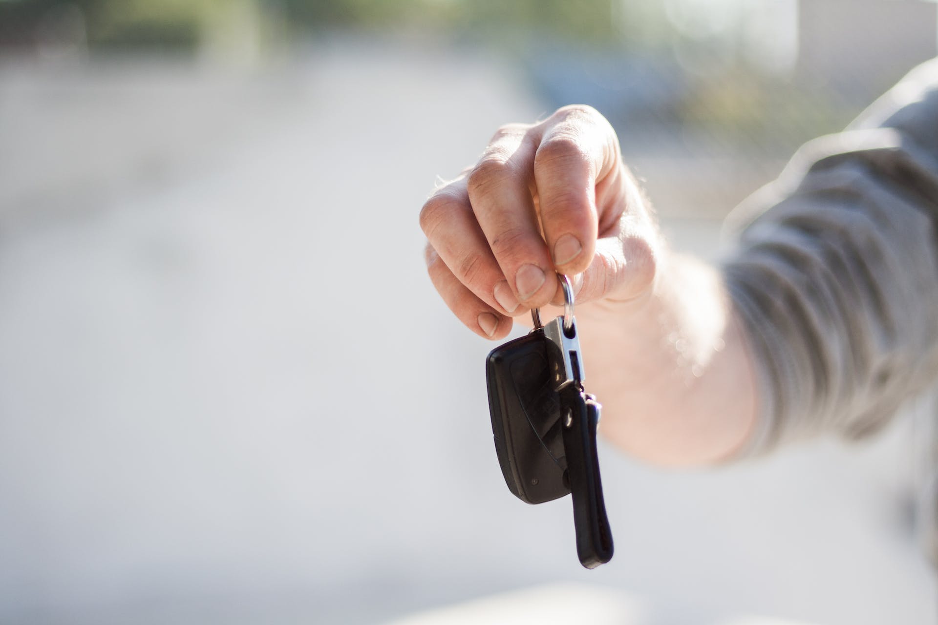 A person holding car keys.
