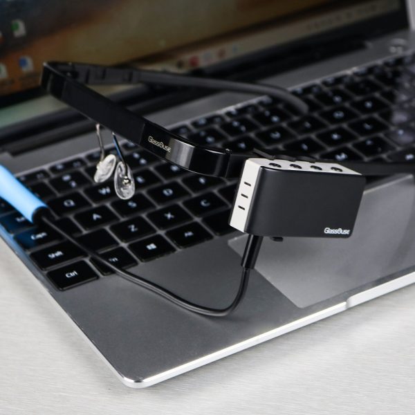 A GlassOuse headset sitting on a laptop.