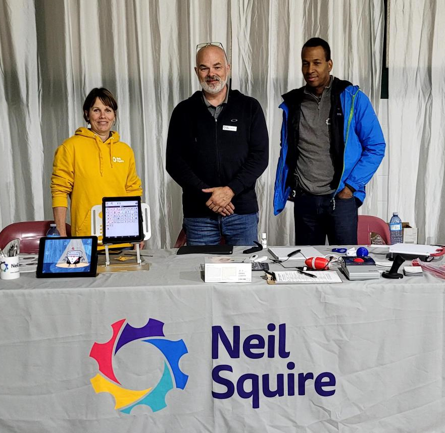 Rebekah, Serge, and Alain from our AT Help Desk team at a Neil Squire booth.