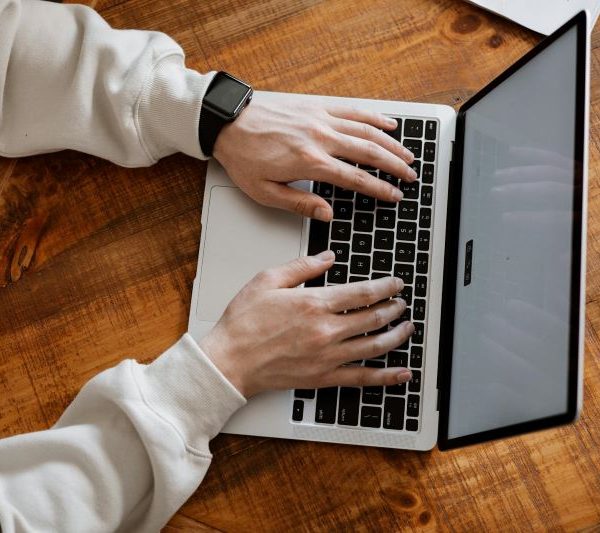 A person uses a laptop.