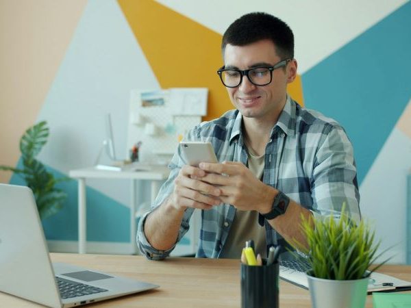 A man uses a smartphone.