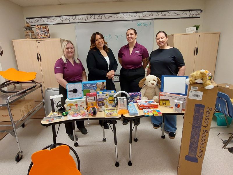Chelsea, Amanda, and clinicians during a kit delivery.