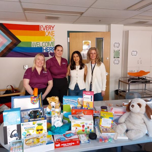 Chelsea, Amanda, and clinicians during a kit delivery.