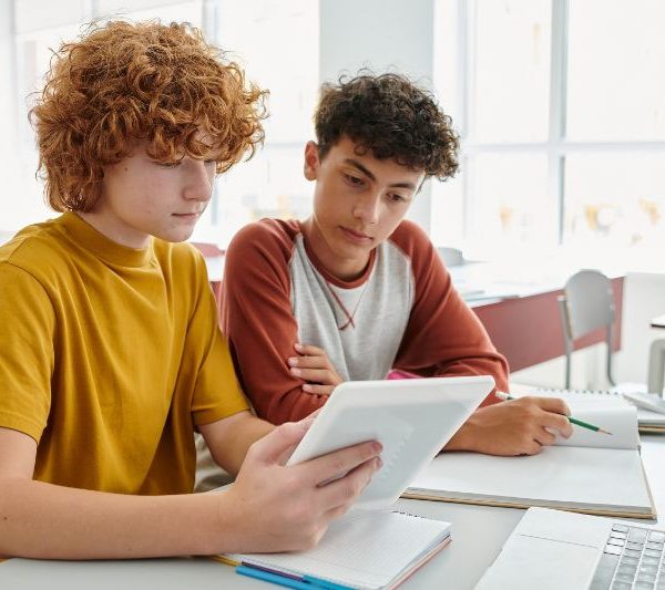 Two students work together on homework.