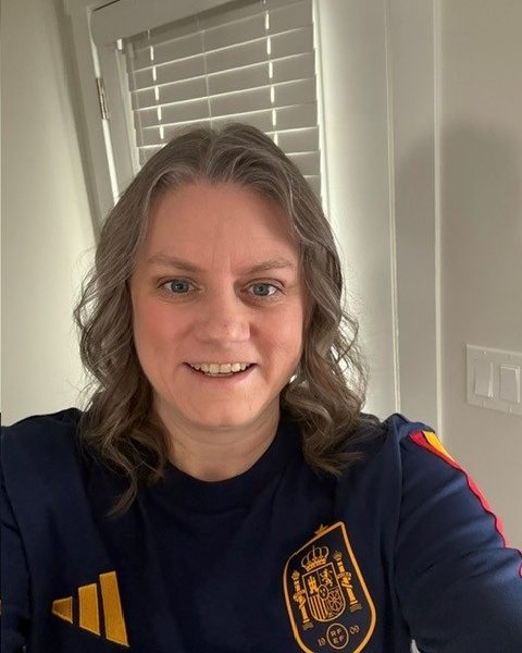 WorkBC Assistive Technology Services participant Mandy wearing a soccer jersey.